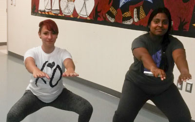 Two women doing squat exercises